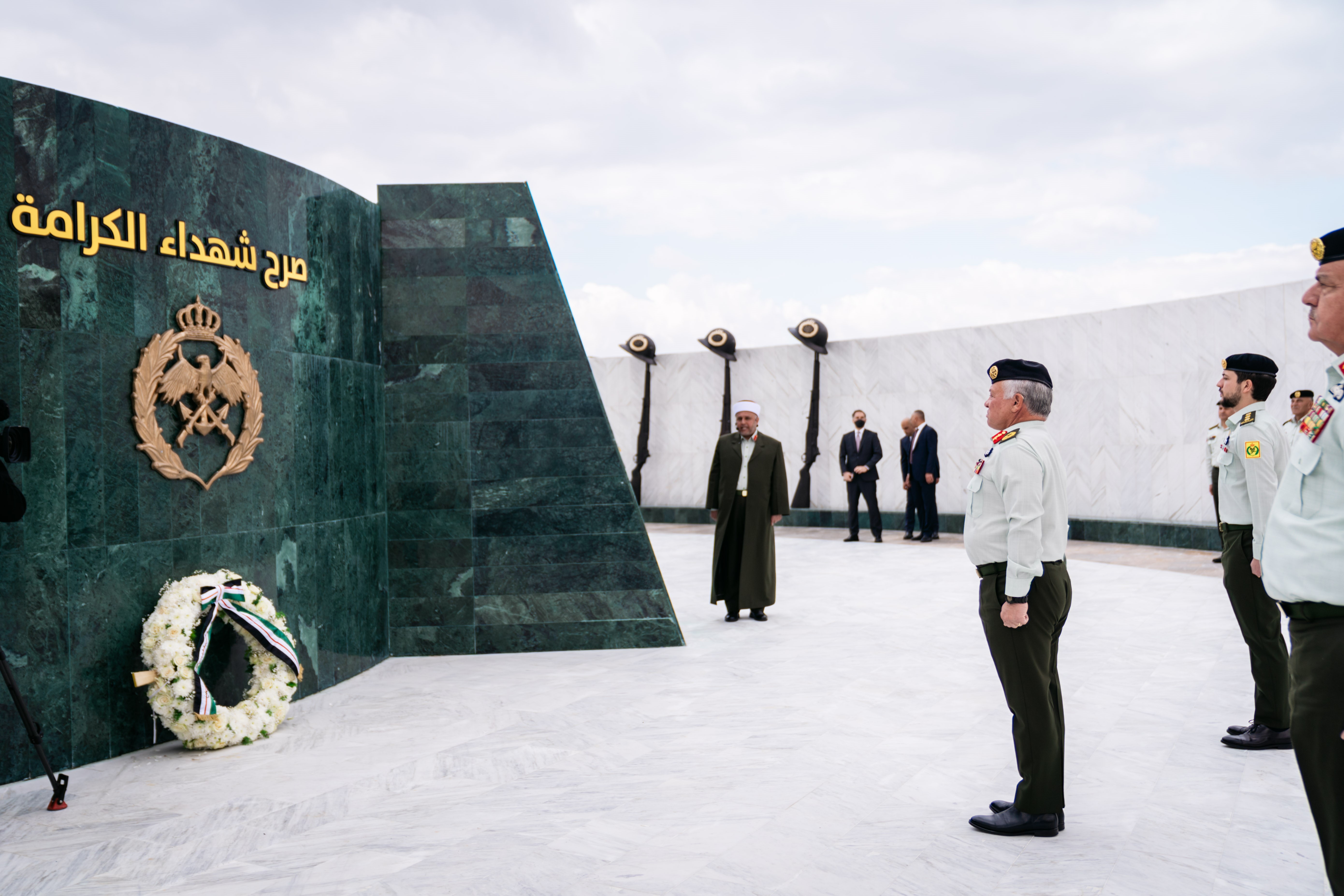 His Majesty King Abdullah, the Supreme Commander of the Jordan Armed Forces-Arab Army, accompanied by HRH Crown Prince Hussein, attends the JAF’s ceremony marking Al Karamah Battle’s 55th anniversary at the memorial site for the martyrs of Al Karamah Battle on Tuesday (Photo courtesy of Royal Court)